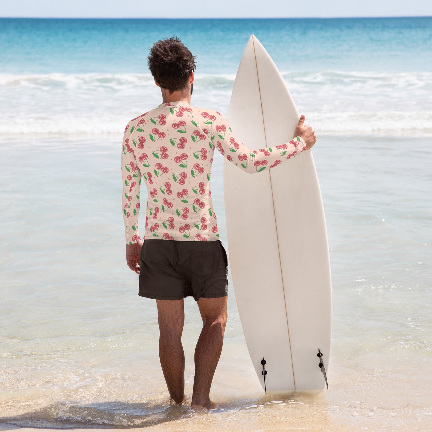 Image: Disco Cherries Mens Rash Guard, part of a family matching swimwear collection. This rash guard has a pink background, with a pattern of red disco ball cherries and stars, by jaecrece