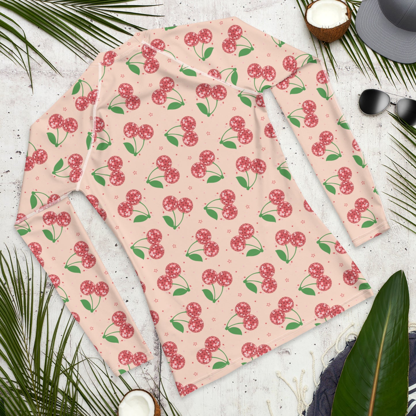 Image: Disco Cherries Mens Rash Guard, part of a family matching swimwear collection. This rash guard has a pink background, with a pattern of red disco ball cherries and stars, by jaecrece