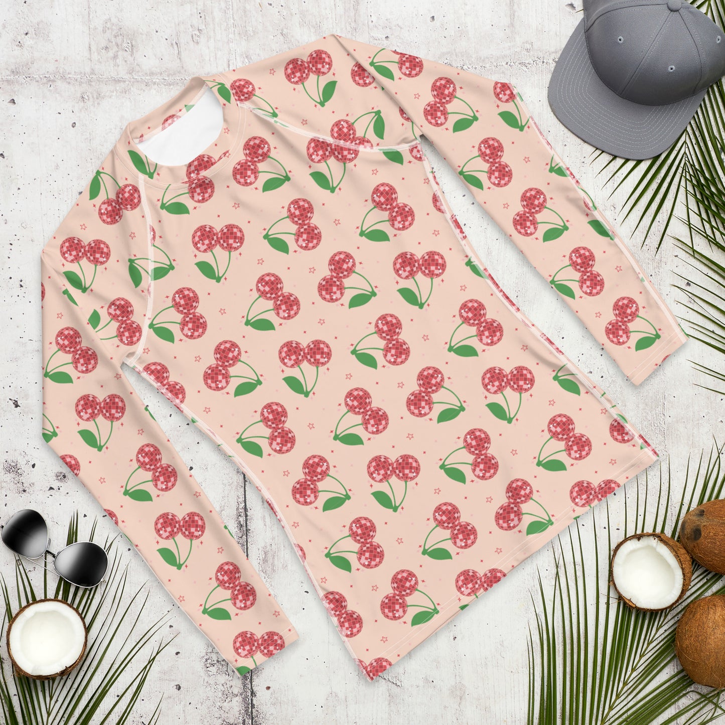Image: Disco Cherries Mens Rash Guard, part of a family matching swimwear collection. This rash guard has a pink background, with a pattern of red disco ball cherries and stars, by jaecrece