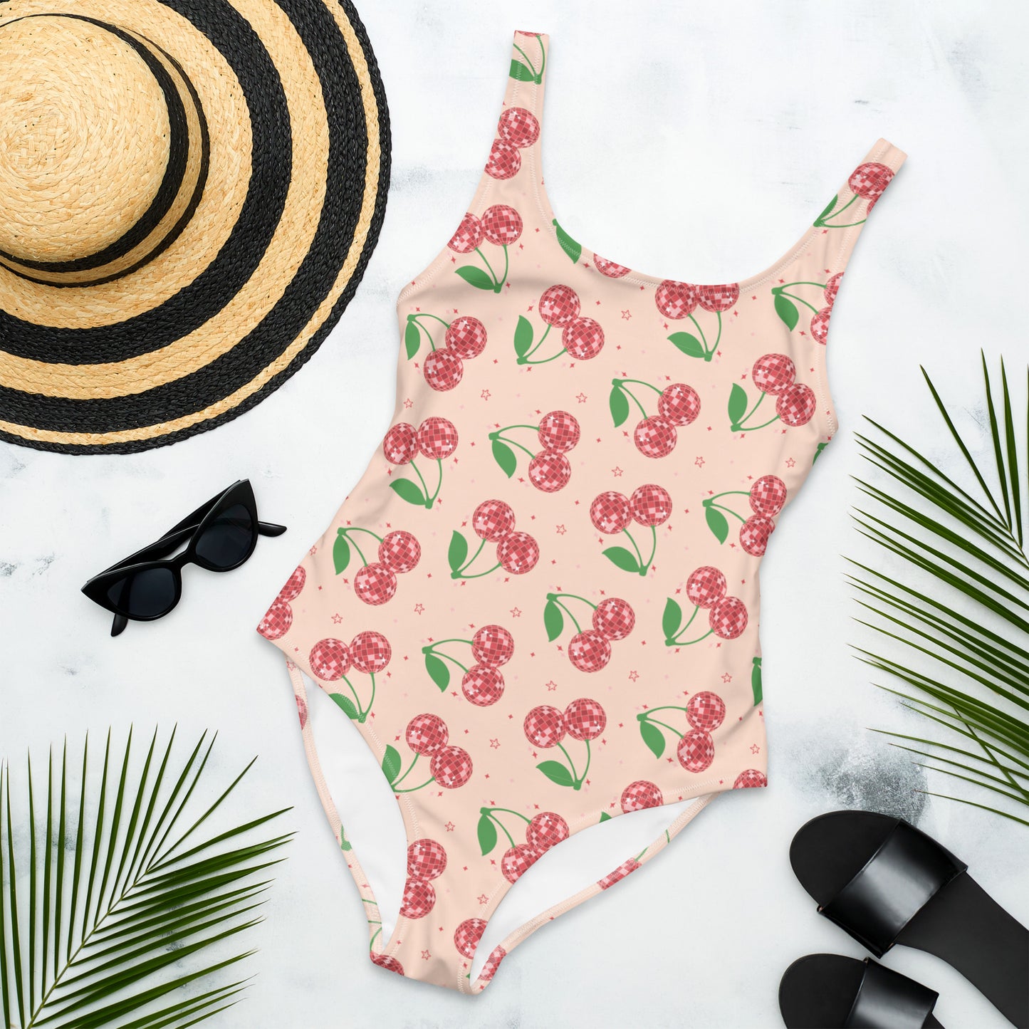 Image: Disco Cherries Women's One Piece Swimsuit, This fruit inspired swimsuit is a part of our Family Matching Swimwear Collection, and features a pink background with red disco ball cherries and stars, by jaecrece