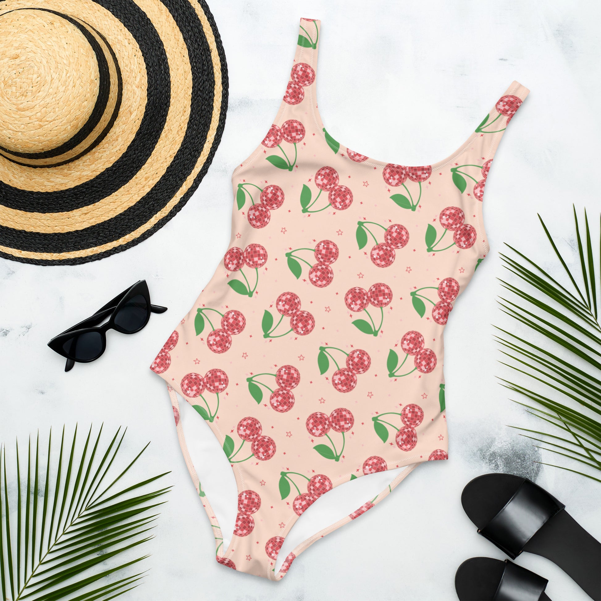 Image: Disco Cherries Women's One Piece Swimsuit, This fruit inspired swimsuit is a part of our Family Matching Swimwear Collection, and features a pink background with red disco ball cherries and stars, by jaecrece