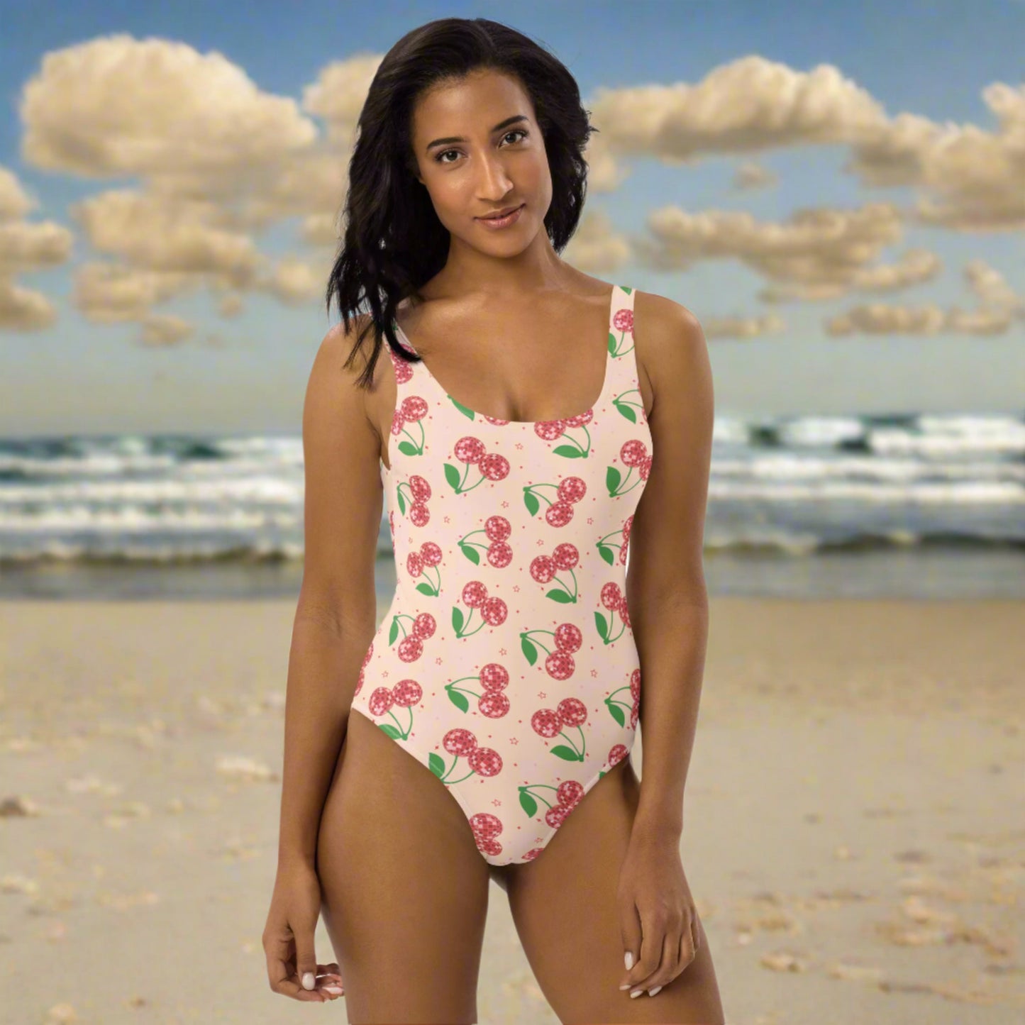 Image: Disco Cherries Women's One Piece Swimsuit, This fruit inspired swimsuit is a part of our Family Matching Swimwear Collection, and features a pink background with red disco ball cherries and stars, by jaecrece