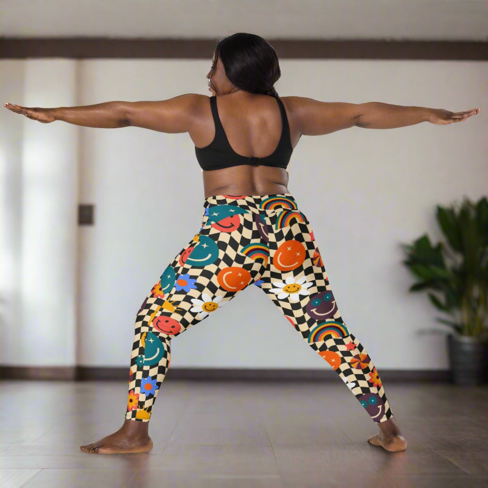 Smiley Face Checkerboard Adult Leggings. These cute retro leggings feature a black and khaki checkerboard background, with smiley face, rainbow and daisy graphics. In adult ladies sizes. by jaecrece.com - jaecrece
