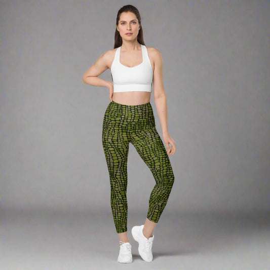 Reptile print ladies leggings. These green yoga pants have a black reptile print pattern. These tights are available in plus/ extended sizes, and are perfect for casual wear, cosplay, Halloween Trick or treating or yoga class. Similar to a snake, lizard or dinosaur print, by jaecrece