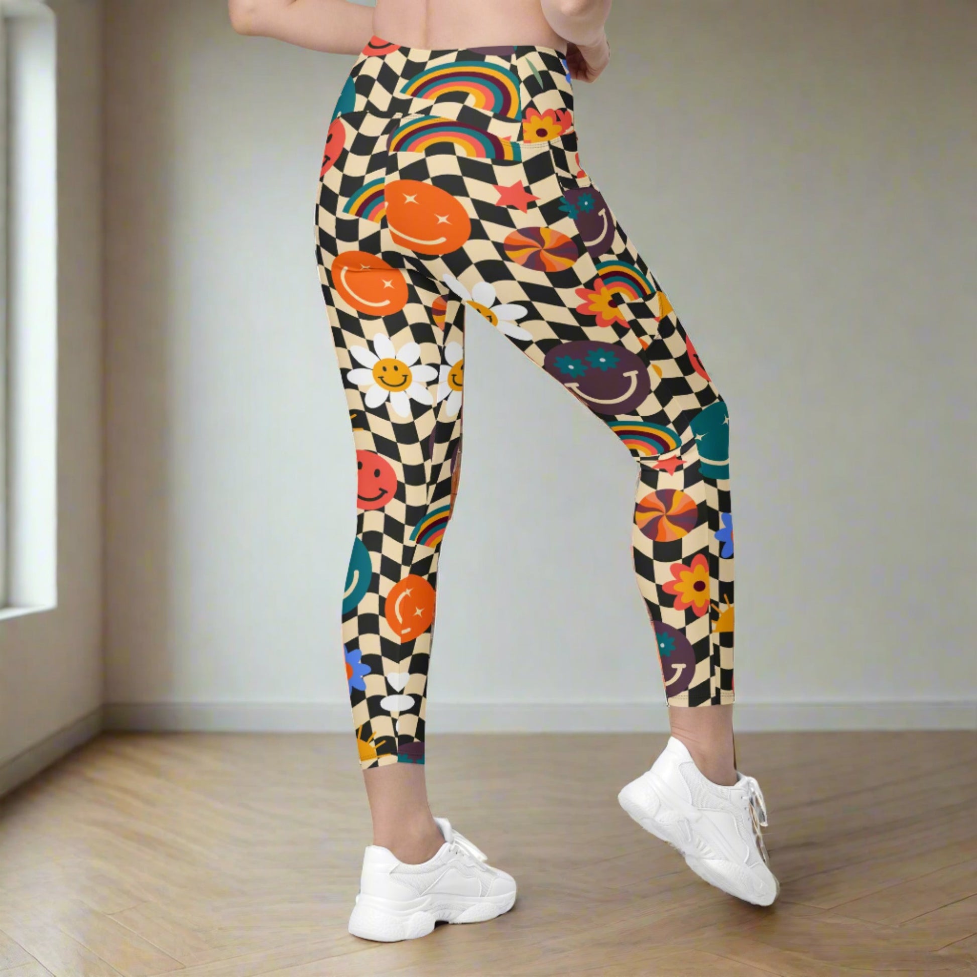 Smiley Face Checkerboard Adult Leggings. These cute retro leggings feature a black and khaki checkerboard background, with smiley face, rainbow and daisy graphics. In adult ladies sizes. by jaecrece.com - jaecrece