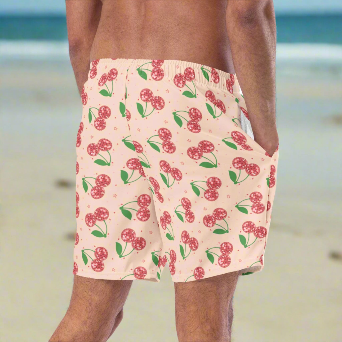 Image: Disco Cherries Mens Swim Trunks in sizes 2T-7, This fruit inspired swimsuit is a part of our Family Matching Swimwear Collection, and features a pink background with red disco ball cherries and stars, by jaecrece