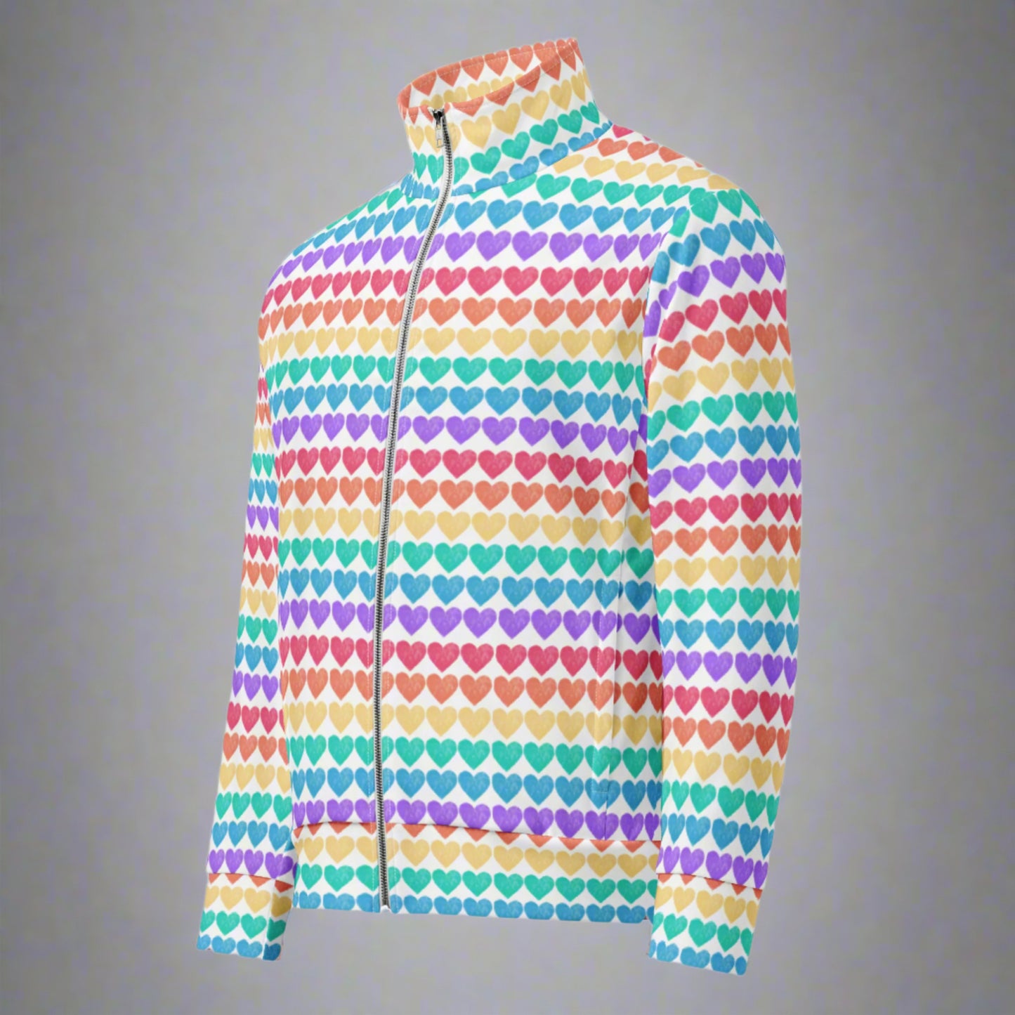Image: Rainbow Hearts Unisex Track Jacket. This lightweight athletic coat has rows of hearts in the color of the rainbow. Bright, cheerful, and full of love—this adult rainbow track jacket features a crisp white background with horizontal rainbow heart stripes. Inclusive sizing (2XS–6XL) makes it accessible to all. It’s a go-to for Pride parades, matching outfits, and layered festival looks, especially when styled with the coordinating leggings.
