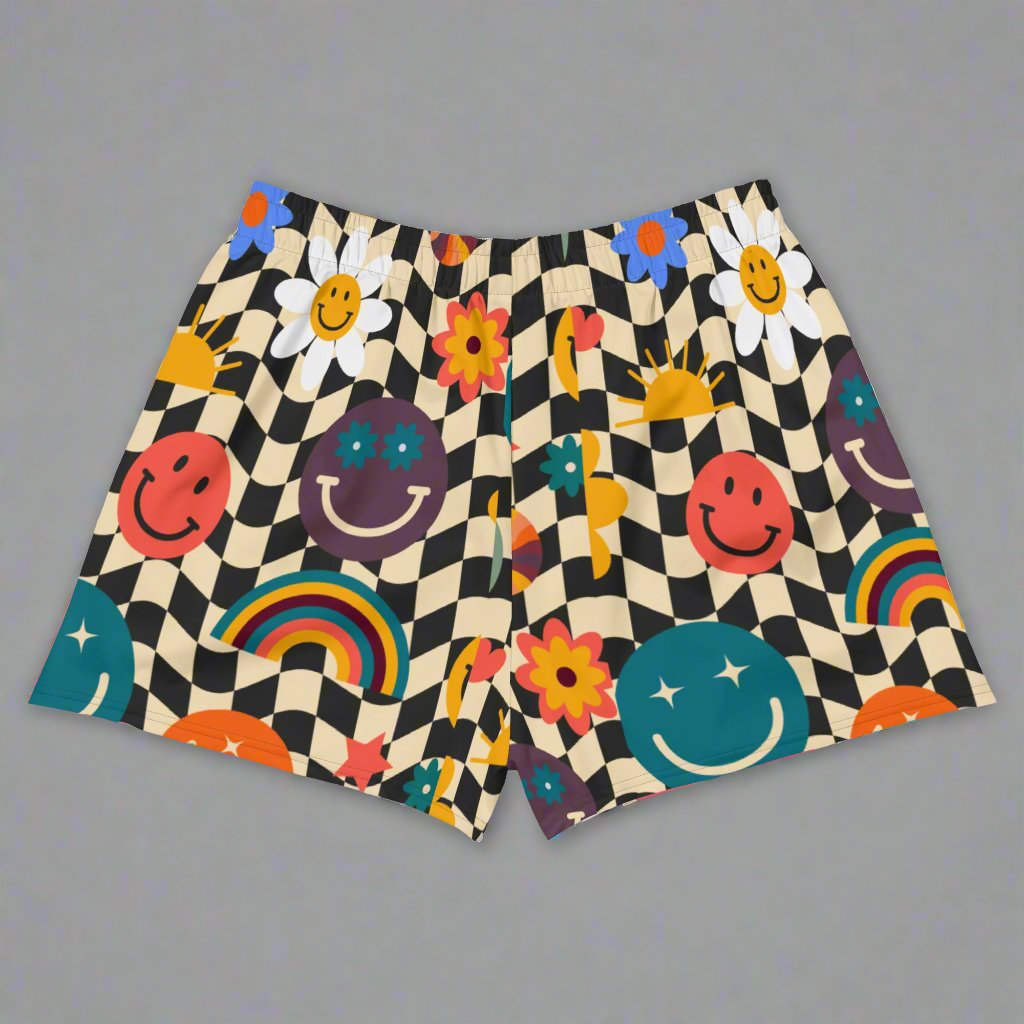 Smiley Face Checkerboard Ladies Athletic Shorts. These cute shorts feature a black and khaki checkerboard background, with smiley face, rainbow and daisy graphics. by jaecrece.com