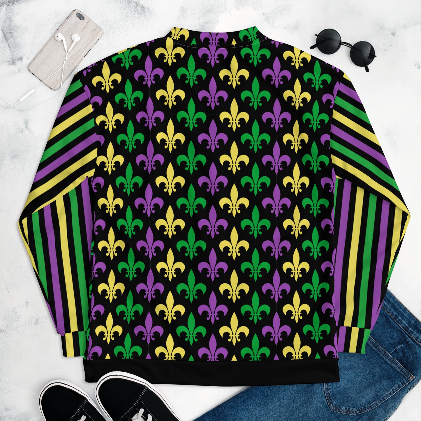 Image: Mardi Gras Unisex Bomber Jacket. This lightweight NOLA apparel is perfect for parades in the French Quarter, or Mardi Gras themed fun runs. It features a gold, green and purple fleur de lis pattern on the front and back, with gold, purple and green stripes going down each arm. Plus sizes available, by jaecrece