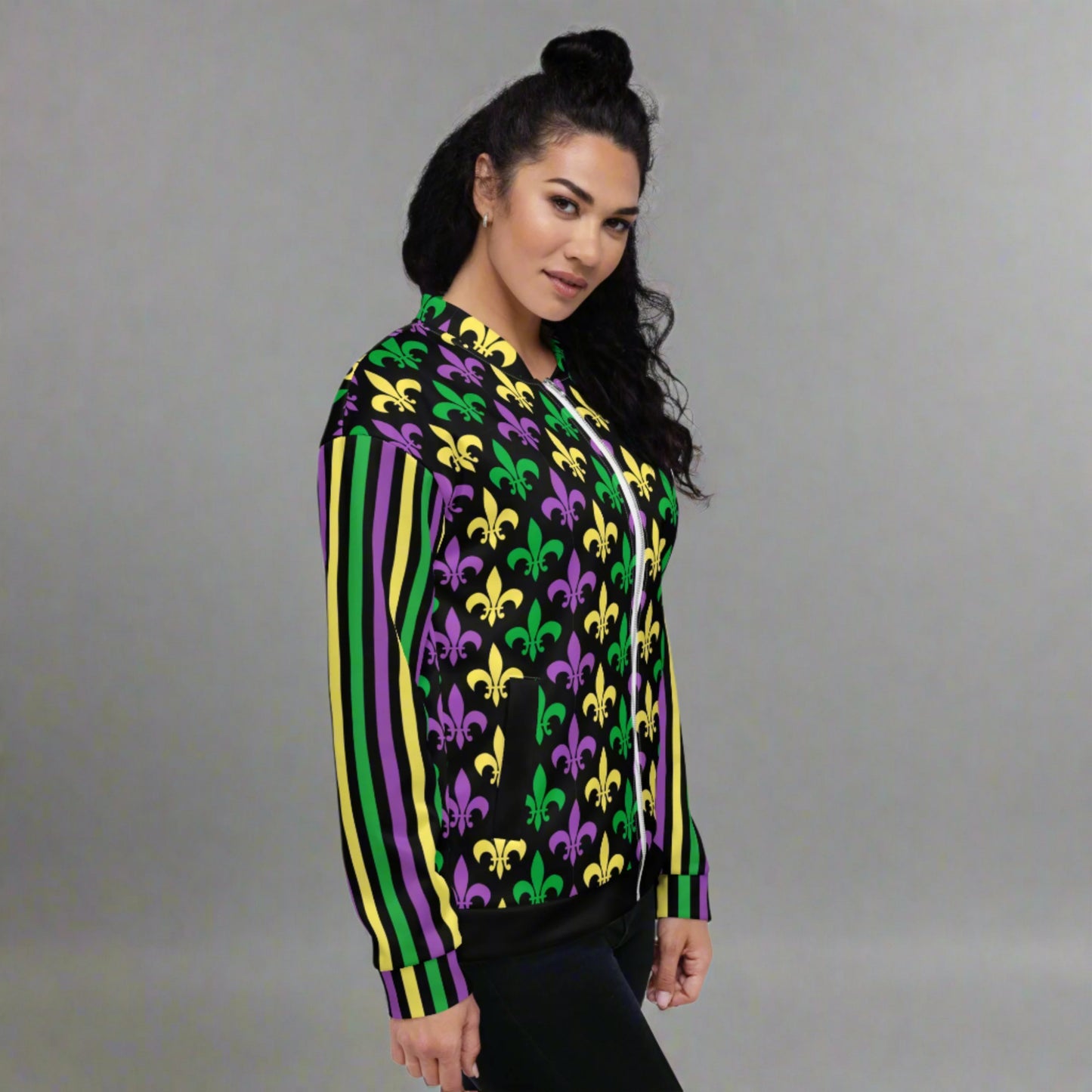 Image: Mardi Gras Unisex Bomber Jacket. This lightweight NOLA apparel is perfect for parades in the French Quarter, or Mardi Gras themed fun runs. It features a gold, green and purple fleur de lis pattern on the front and back, with gold, purple and green stripes going down each arm. Plus sizes available, by jaecrece
