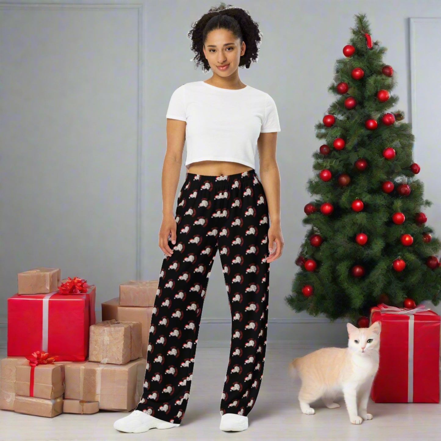 Celebrate the season in comfort and festive style with these Meowy Christmas adult wide leg pants, available in inclusive sizes 2XS to 6XL. Designed with a cozy fit and a black background featuring a repeating pattern of the Meowy Christmas graphic, these holiday pants are perfect for cat lovers. Part of a matching family collection, they pair perfectly with our Meowy Christmas tops and accessories. Ideal for lounging, gifting, or festive family photos.