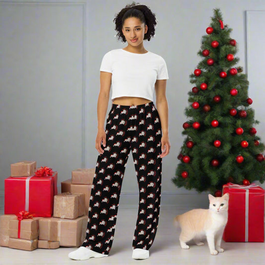 Celebrate the season in comfort and festive style with these Meowy Christmas adult wide leg pants, available in inclusive sizes 2XS to 6XL. Designed with a cozy fit and a black background featuring a repeating pattern of the Meowy Christmas graphic, these holiday pants are perfect for cat lovers. Part of a matching family collection, they pair perfectly with our Meowy Christmas tops and accessories. Ideal for lounging, gifting, or festive family photos.
