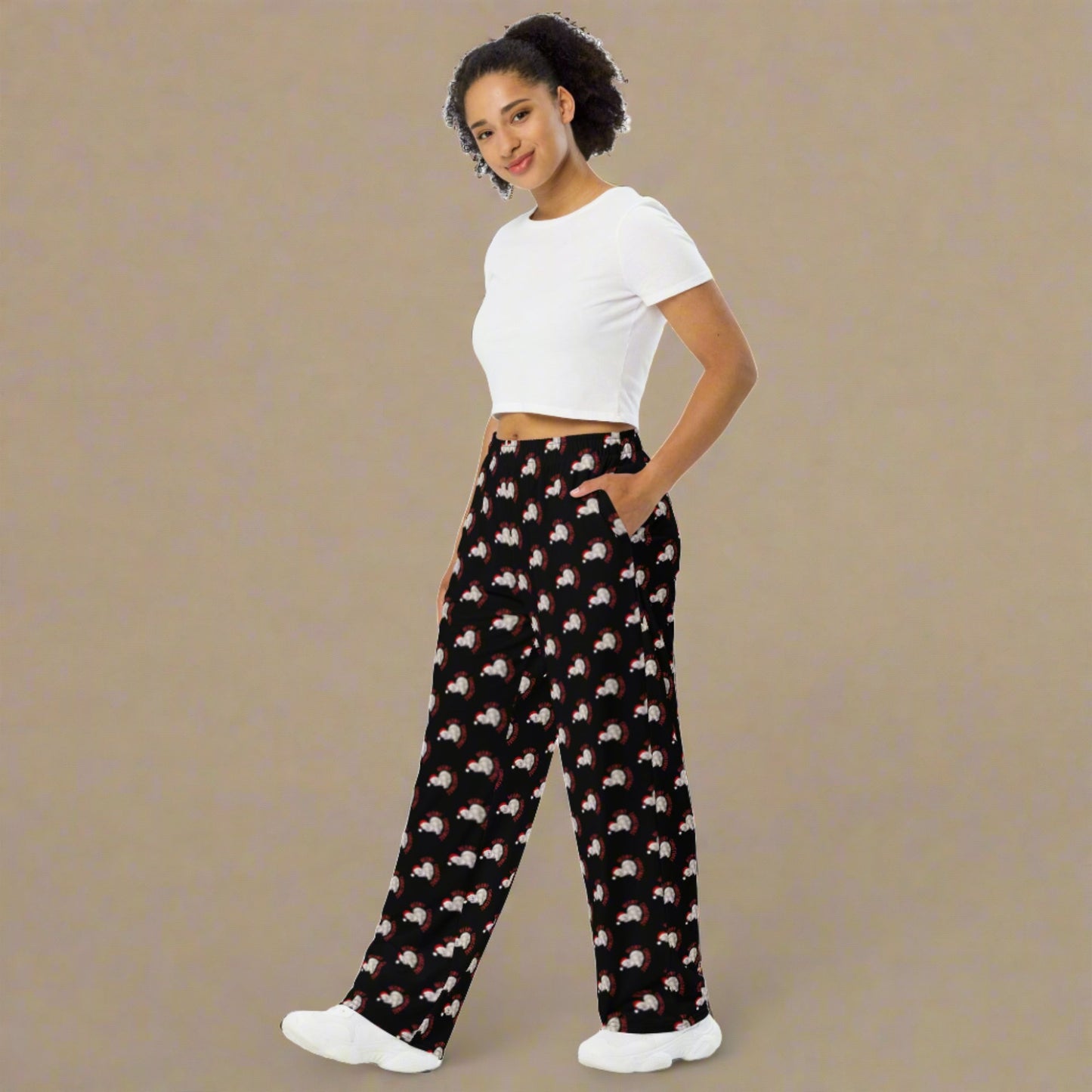 Add a playful twist to your holiday attire with these wide leg pants for adults, decorated in our Meowy Christmas repeating print over a sleek black background. With sizes from 2XS–6XL, they offer a relaxed fit that’s perfect for lounging or matching with the whole family. Pair with other Meowy Christmas pieces for a cozy cat-themed celebration.