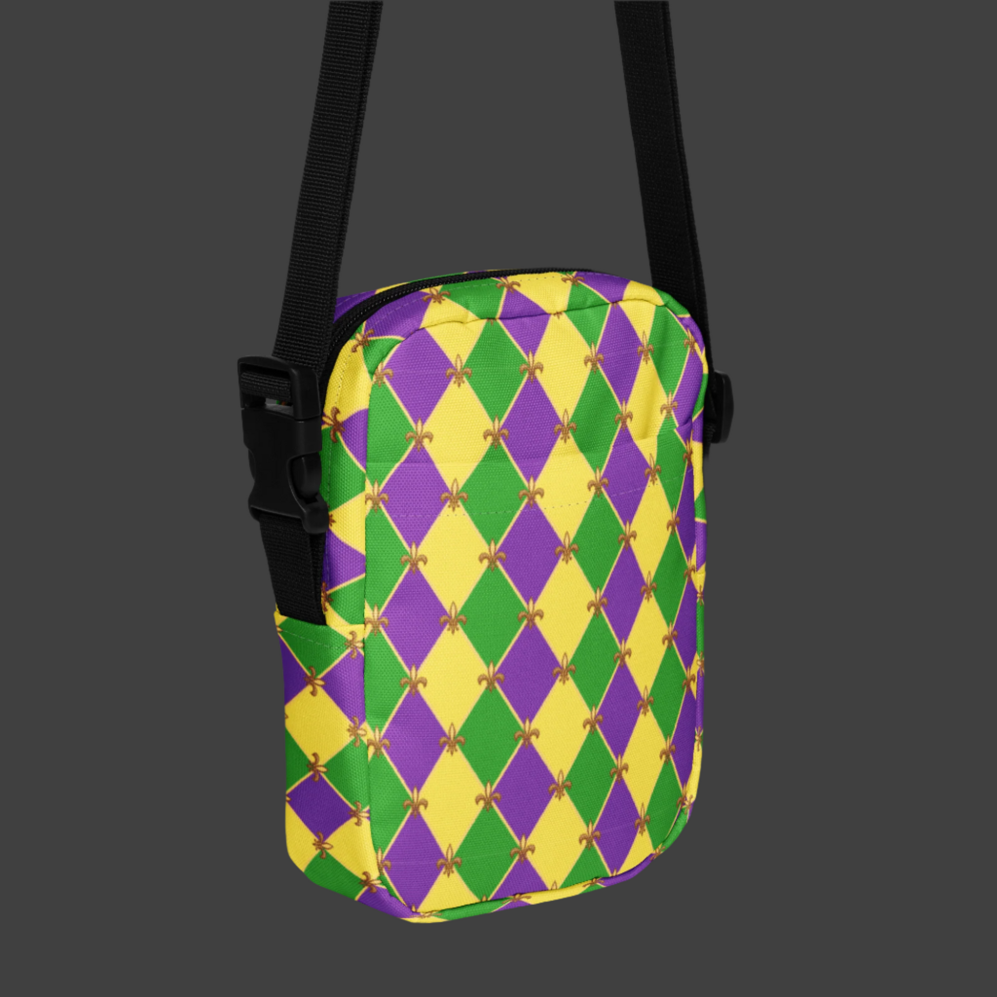Bright and festive utility crossbody bag for Mardi Gras, showcasing a harlequin checkerboard design in purple, green, and gold. This small tote can be worn multiple ways—sling style, hip bag, or mini backpack—making it the perfect accessory for French Quarter adventures, NOLA parades, or Carnival parties. Water-resistant and fun, with matching Mardi Gras leggings for the entire family in our store.