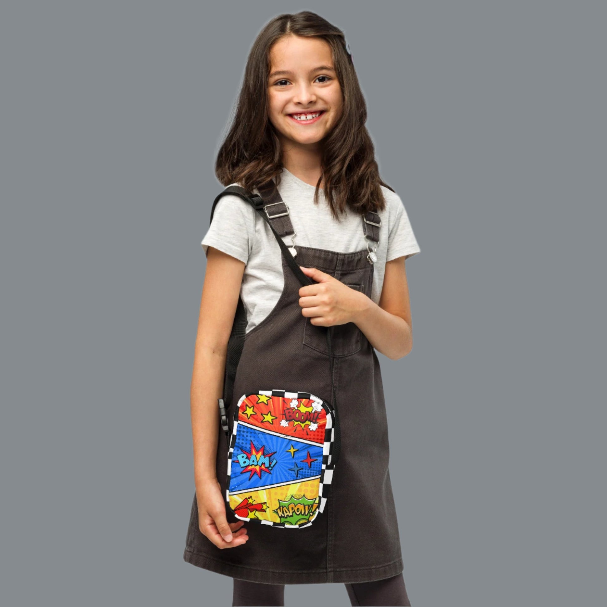 Comic Book Crossbody Bag, Comic Con Convention Small Tote, Cosplay Fanny Pack, Music Festival Sling Pouch, Waist Hip Pouch Boy Gift. This small canvas camera bag features comic book graphics in red, blue and yellow, with the words Boom Bam Kapow.