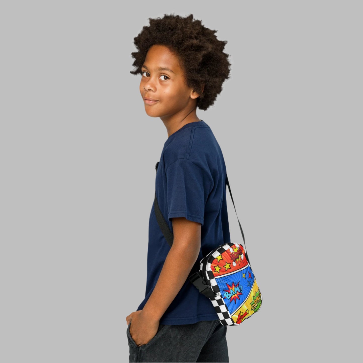 Comic Book Crossbody Bag, Comic Con Convention Small Tote, Cosplay Fanny Pack, Music Festival Sling Pouch, Waist Hip Pouch Boy Gift. This small canvas camera bag features comic book graphics in red, blue and yellow, with the words Boom Bam Kapow.