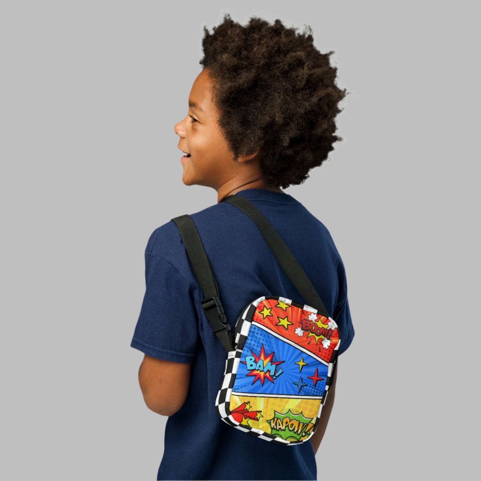 Comic Book Crossbody Bag, Comic Con Convention Small Tote, Cosplay Fanny Pack, Music Festival Sling Pouch, Waist Hip Pouch Boy Gift. This small canvas camera bag features comic book graphics in red, blue and yellow, with the words Boom Bam Kapow.