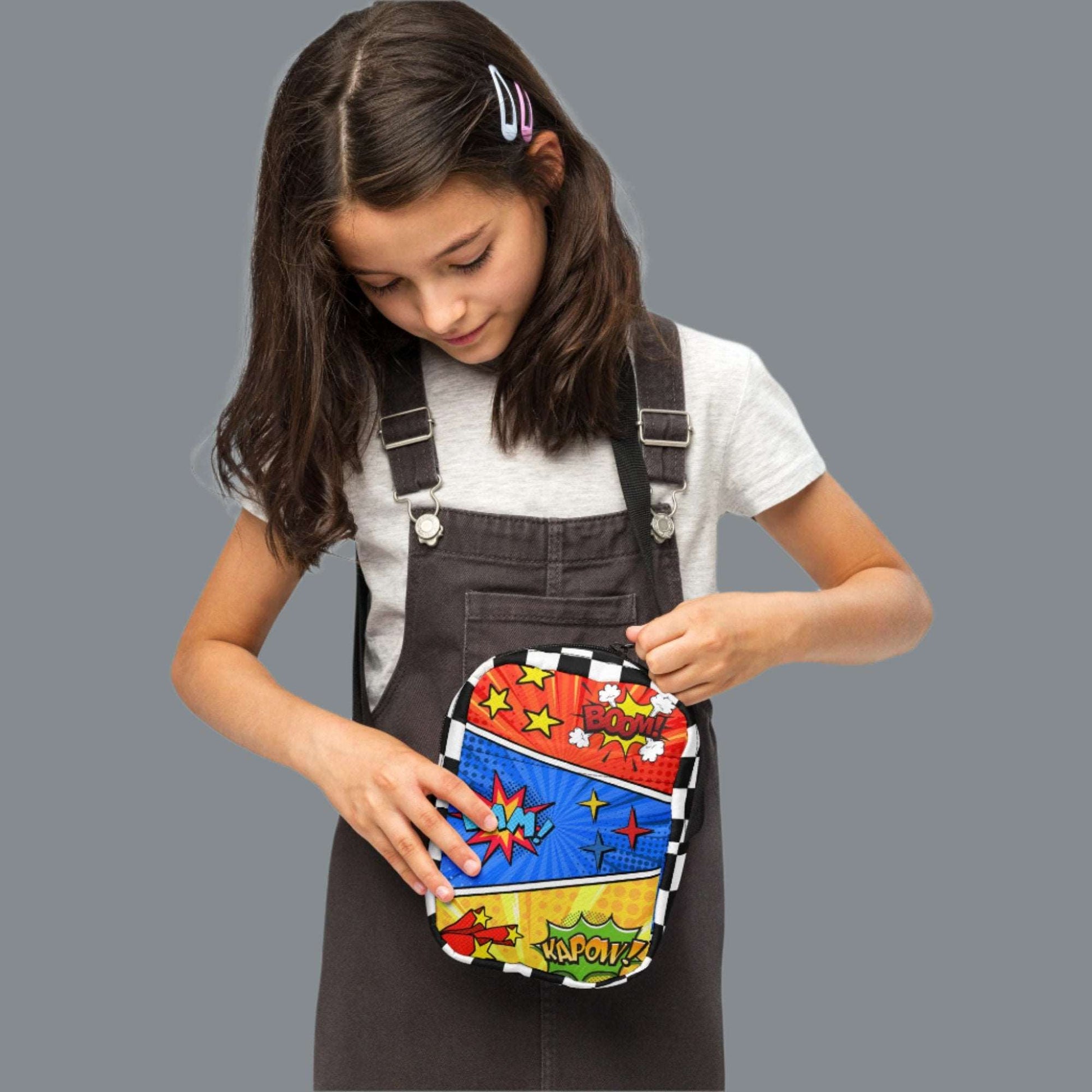 Comic Book Crossbody Bag, Comic Con Convention Small Tote, Cosplay Fanny Pack, Music Festival Sling Pouch, Waist Hip Pouch Boy Gift. This small canvas camera bag features comic book graphics in red, blue and yellow, with the words Boom Bam Kapow.