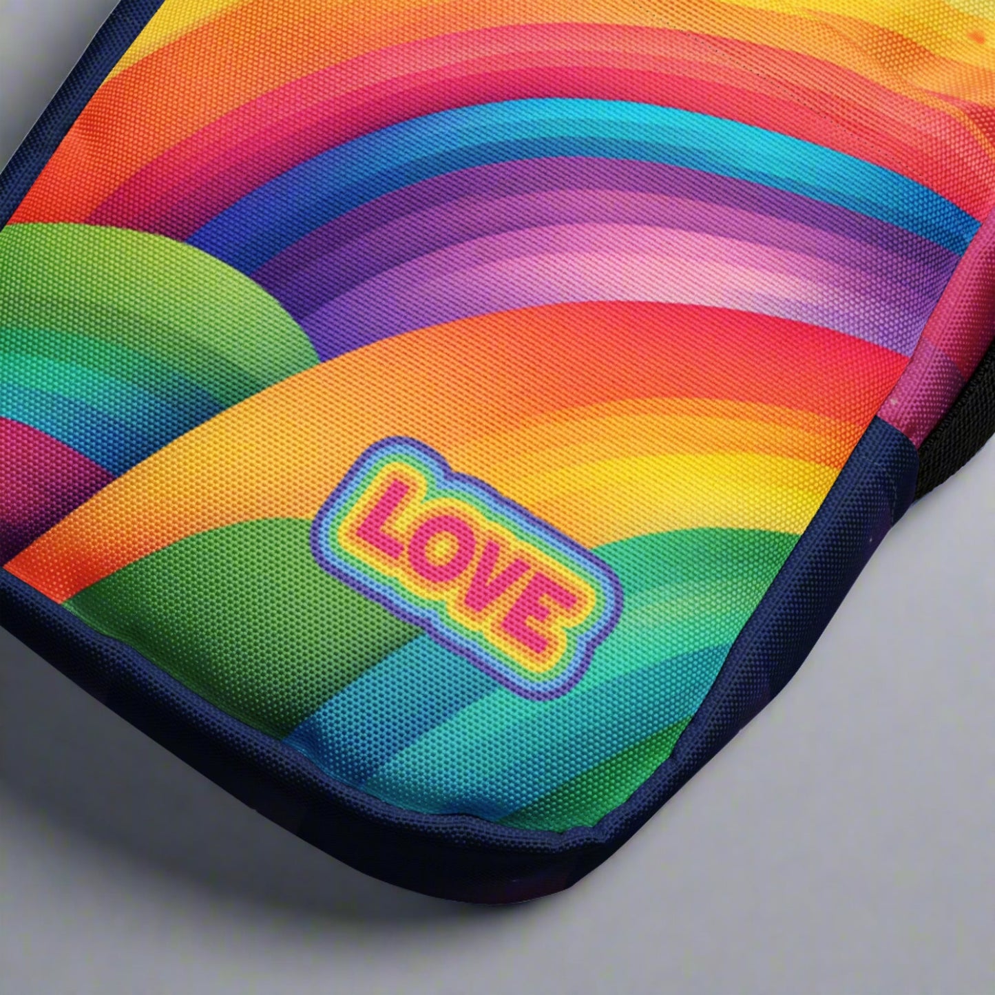 Rainbow crossbody bag, with the word LOVE printed on the front