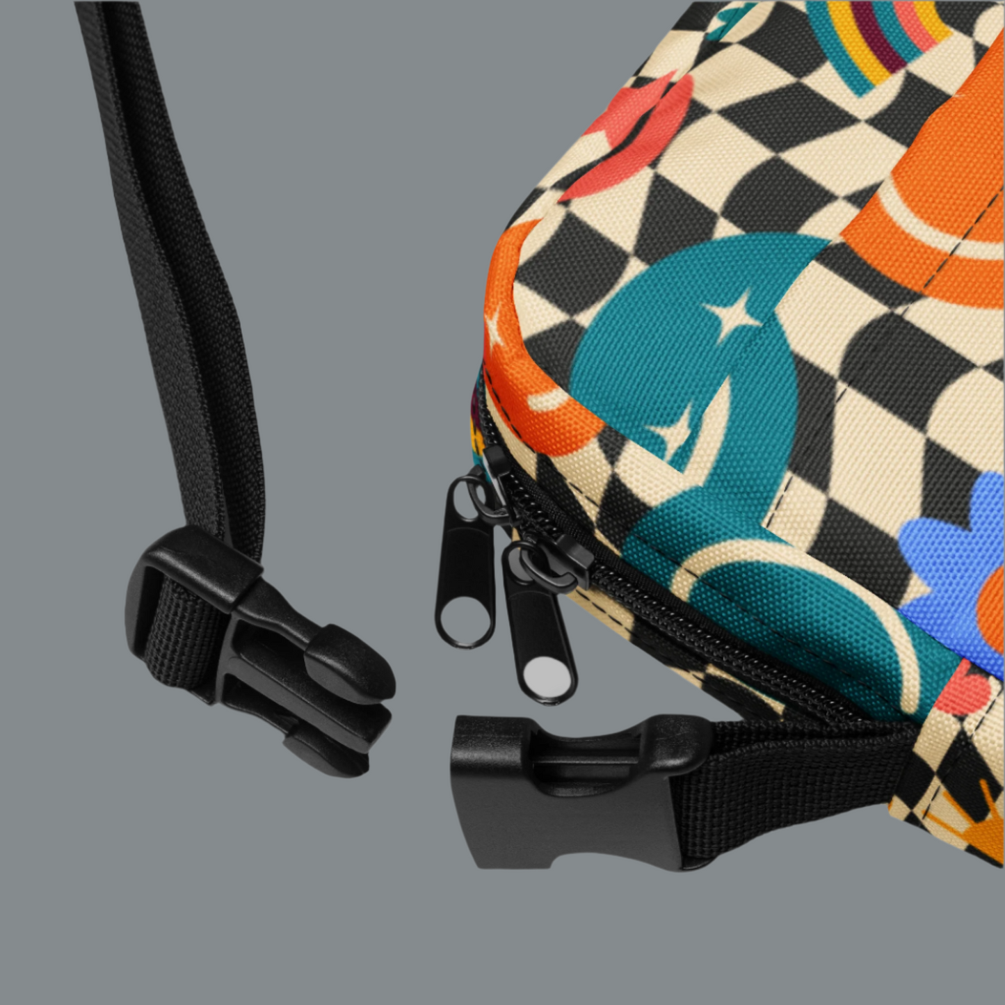 Smiley Face Checkerboard Utility Crossbody Bag. This cute small canvas carryall is eco friendly, and features a black and khaki checkerboard background, with smiley face, rainbow and daisy graphics. It is perfect for hiking, vacations and festivals, and can be worn across the chest, or on the hips/ waist. By jaecrece.com