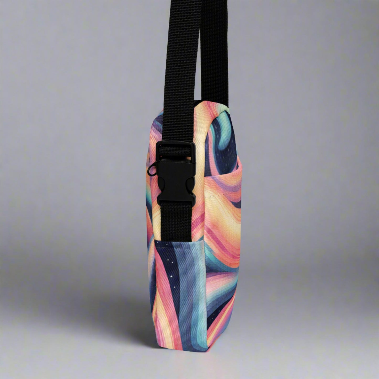 Celestial Canvas Utility Crossbody Bag, featuring pastel shades of pink and blue swirling around midnight stars, by jaecrece.com
