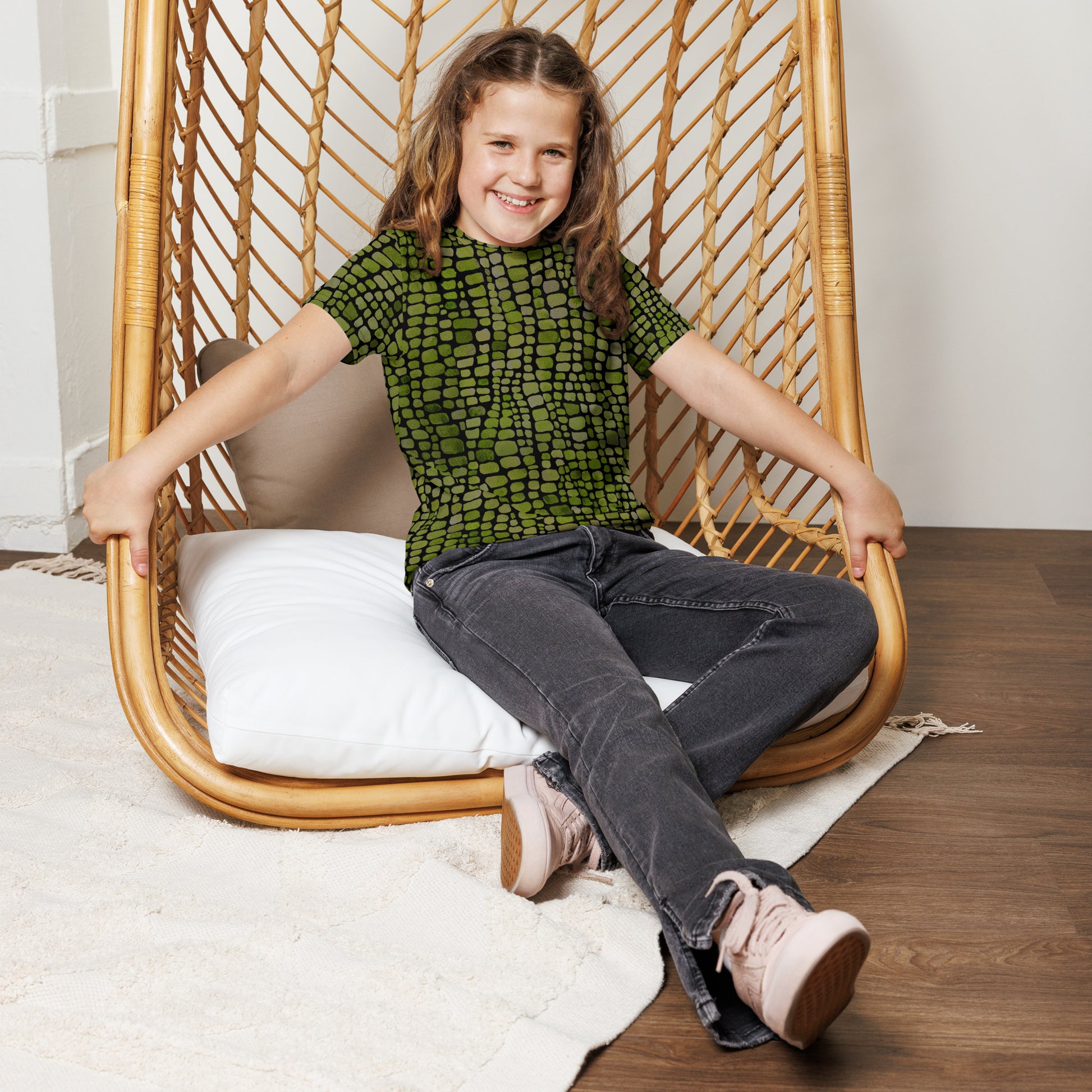 Youth t-shirt with all-over green reptile scale pattern, available in sizes 8–20. Ideal for kids who love dinosaurs, snakes, and lizards, this bold shirt doubles as a costume piece or everyday statement tee. Great for jungle parties, imaginative dress-up, and nature-inspired fun, it offers comfort and style for school days, outdoor play, or themed events. A must-have for adventurous tweens with a wild sense of style.