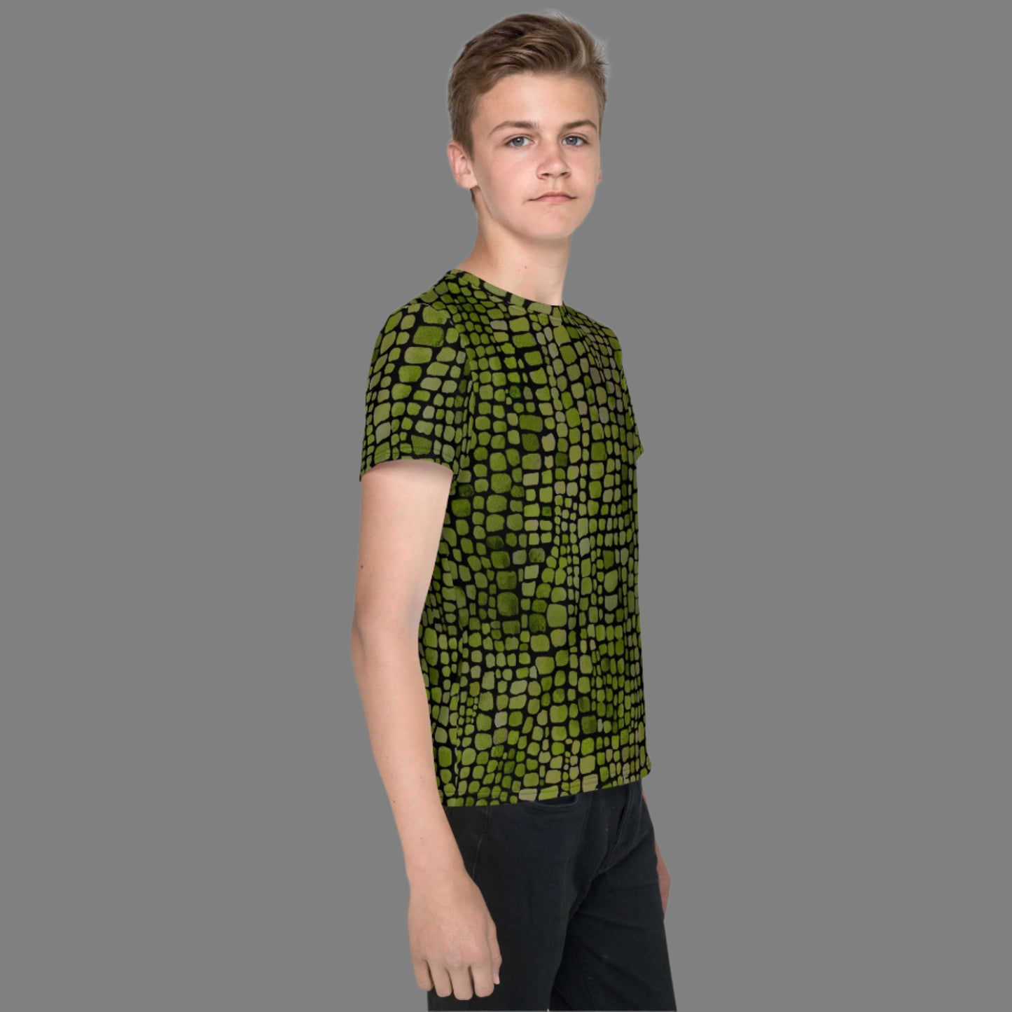 Green reptile print youth t-shirt for boys and girls in sizes 8–20. This all-over scale design is perfect for snake, lizard, or dinosaur costumes and makes a fun statement for nature lovers. A versatile pick for themed birthdays, jungle parties, school events, and everyday wear. Lightweight, breathable fabric and vivid design make it a hit for summer, outdoor adventures, and kids who love bold, wild prints.