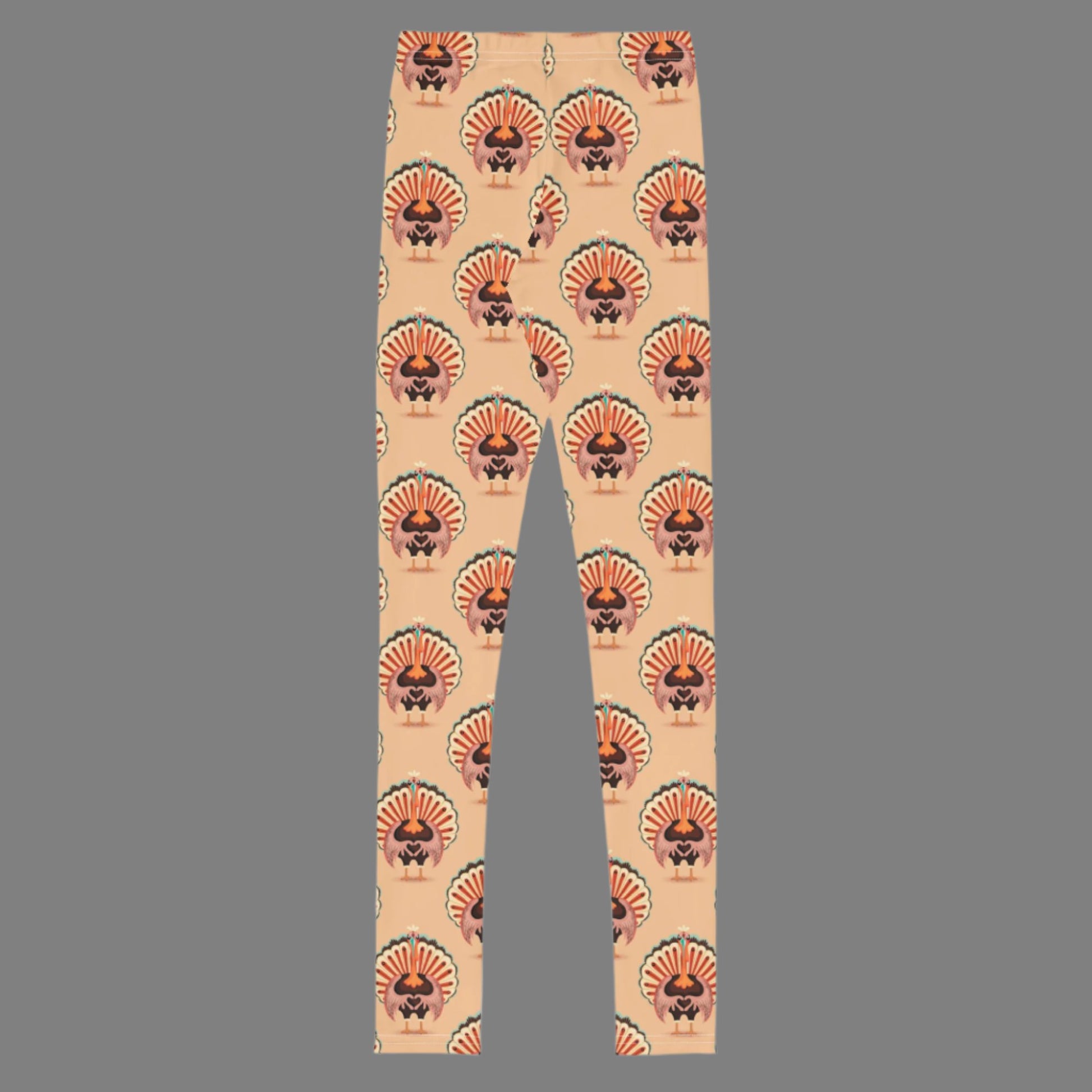 Thanksgiving Turkey Love child leggings. These girls yoga pants are peach, and have a repeating pattern of turkeys showing the love sign with their hands. These girls child tights make a great gift, or a family matching outfit for the Turkey Trot! by jaecrece