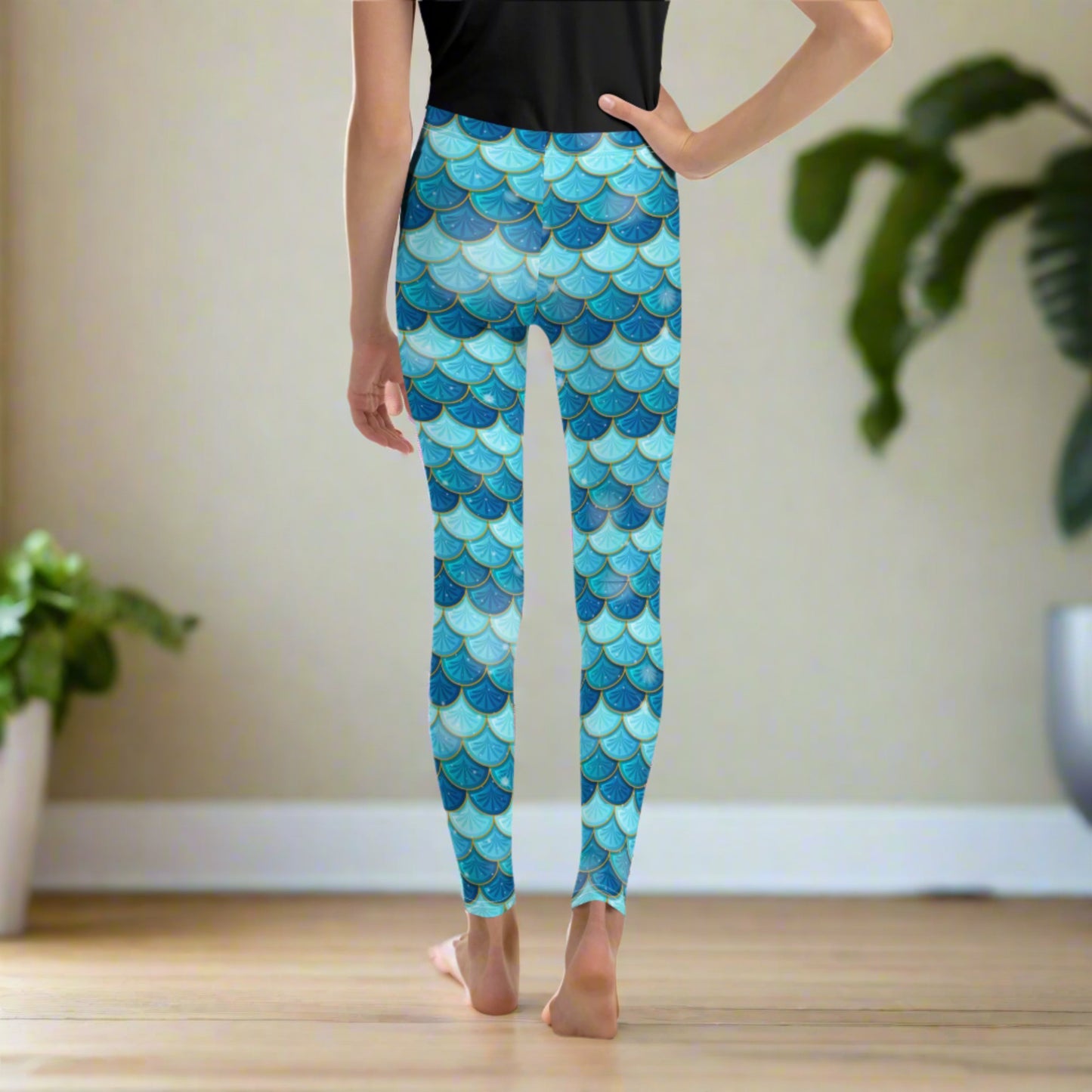 Image: Mermaid Youth Girls Leggings feature a stunning blue scale print, perfect for tweens and teens in sizes 8-20. Perfect for girls who love the mermaid aesthetic, by jaecrece