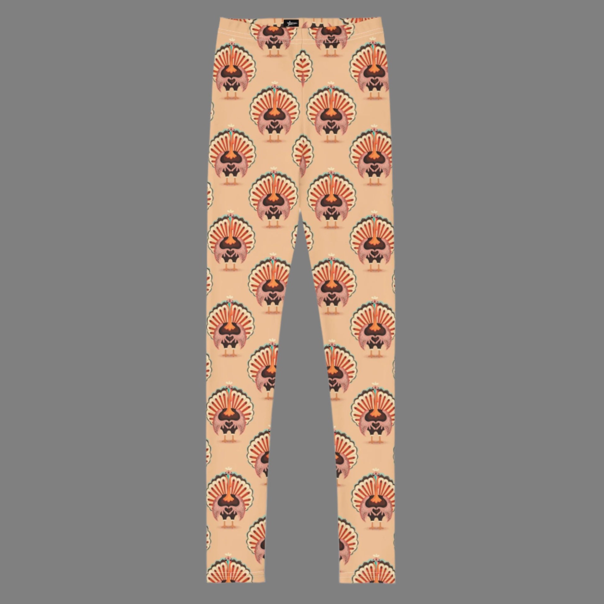 Thanksgiving Turkey Love child leggings. These girls yoga pants are peach, and have a repeating pattern of turkeys showing the love sign with their hands. These girls child tights make a great gift, or a family matching outfit for the Turkey Trot! by jaecrece