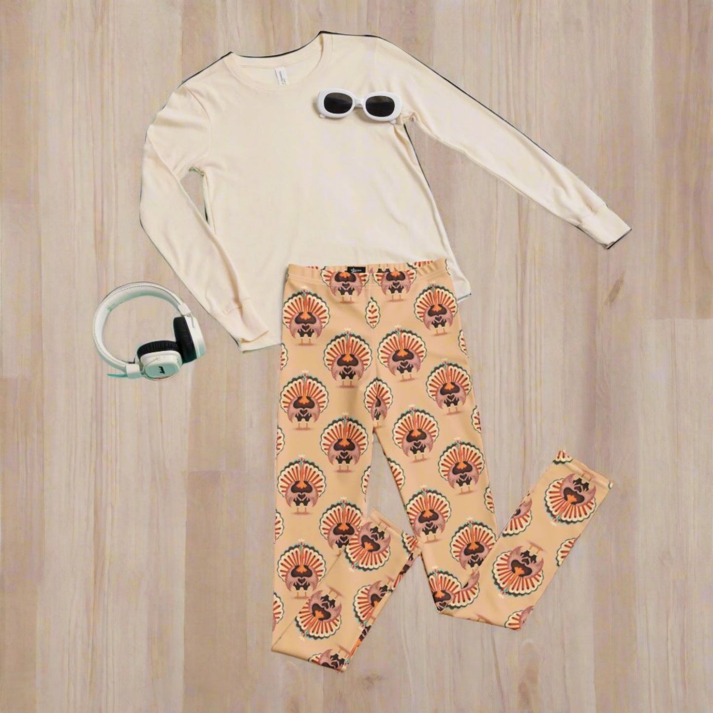 Thanksgiving Turkey Love child leggings. These girls yoga pants are peach, and have a repeating pattern of turkeys showing the love sign with their hands. These girls child tights make a great gift, or a family matching outfit for the Turkey Trot! by jaecrece