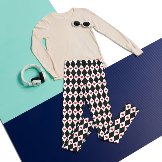 Image: Black and white harlequin check youth leggings with red heart accents. These yoga pants are designed for comfort and flexibility, by jaecrece