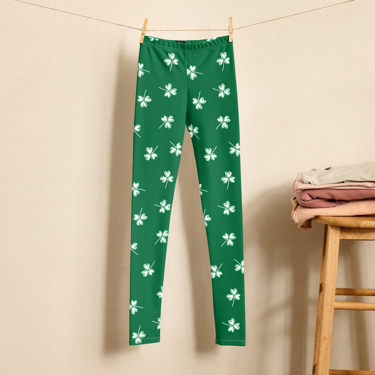 Image: Family Matching St Patricks Day Shamrock Leggings. Festive yoga pants with green background and white four leaf clovers. Available in sizes for toddler girls, teens, tweens, and women. Perfect for a St Pattys Day parade or fun run, by jaecrece