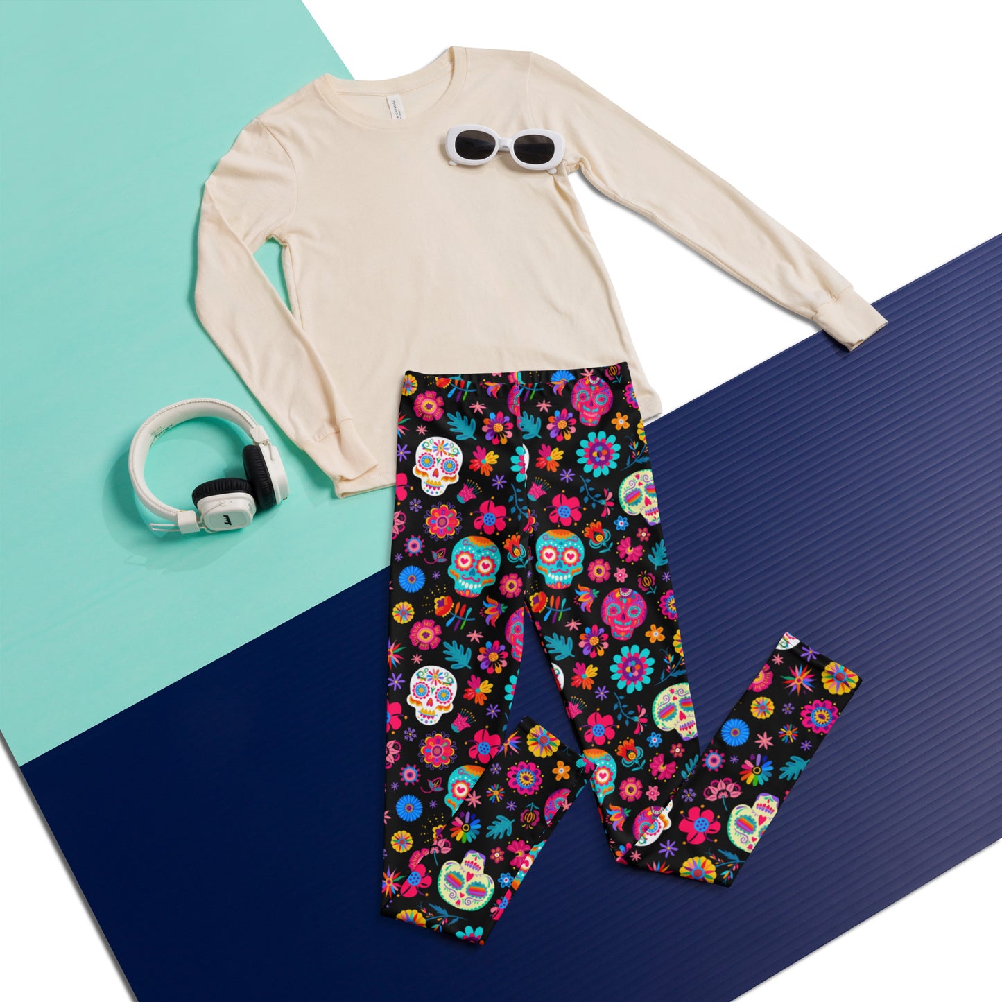 Youth sugar skull leggings for girls in sizes 8–20 with a vibrant Día de los Muertos print. These colorful and comfortable pants are ideal for fall festivals, classroom parties, and cultural events. Featuring soft stretch fabric and a bold skull pattern, they’re also available in matching toddler and women’s sizes for coordinated family fun. Celebrate Day of the Dead in comfy kids’ style.