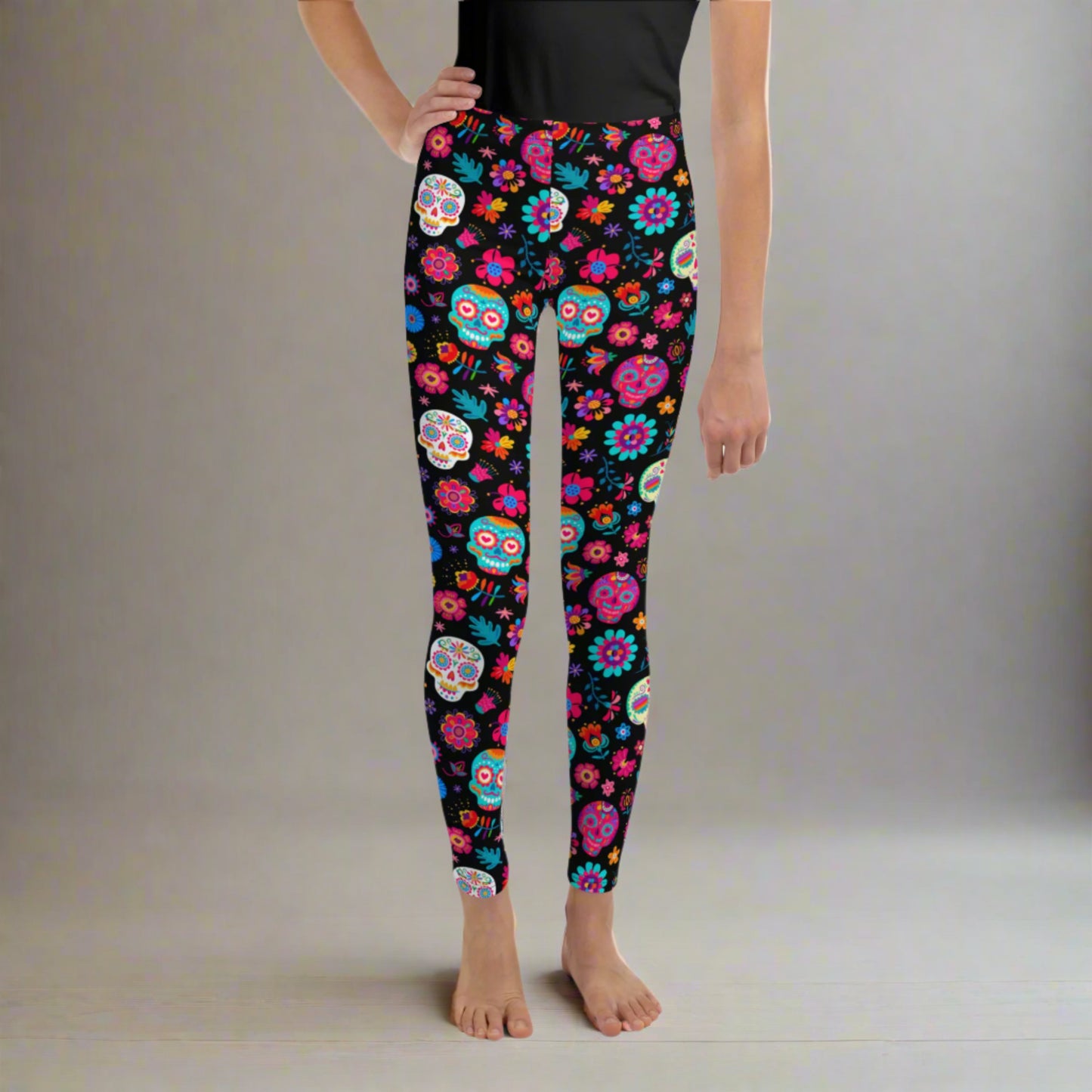 Vibrant and bold, these girls' Día de los Muertos leggings in youth sizes 8–20 are perfect for kids celebrating Hispanic culture or dressing up for Halloween. The festive sugar skull design brings color and energy to school events, parades, and fall outings. Pair with matching toddler and women’s leggings for a full family look that celebrates tradition and style in comfort.