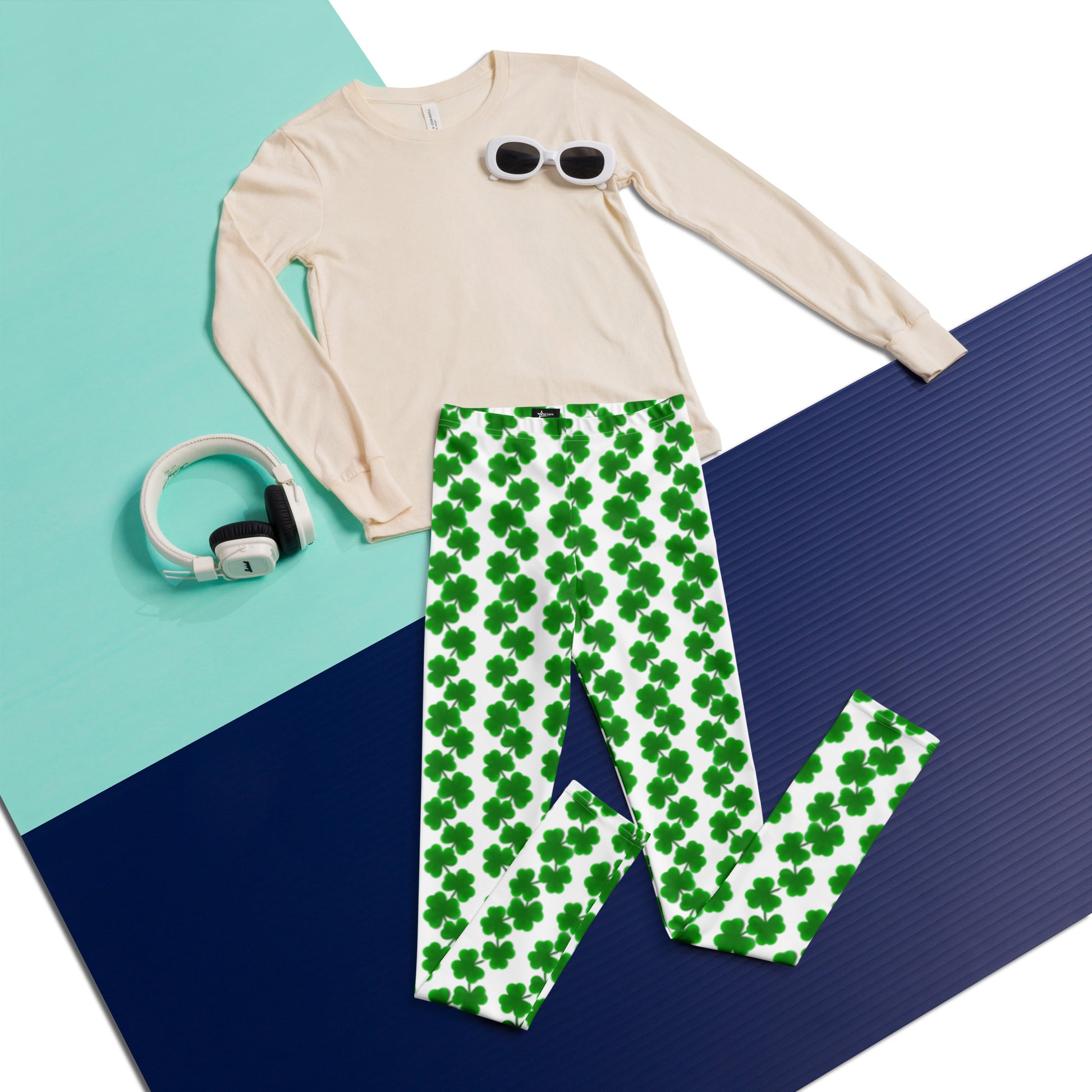 Girls St. Patrick’s Day leggings in youth sizes 8–20 with a festive shamrock print. These white leggings are decorated with chains of green clovers running vertically down each leg, perfect for holiday events or everyday wear. Great for Irish-themed school days or family photos, the soft, stretchy material offers comfort and flexibility for active kids. A lucky wardrobe pick for young girls in March.