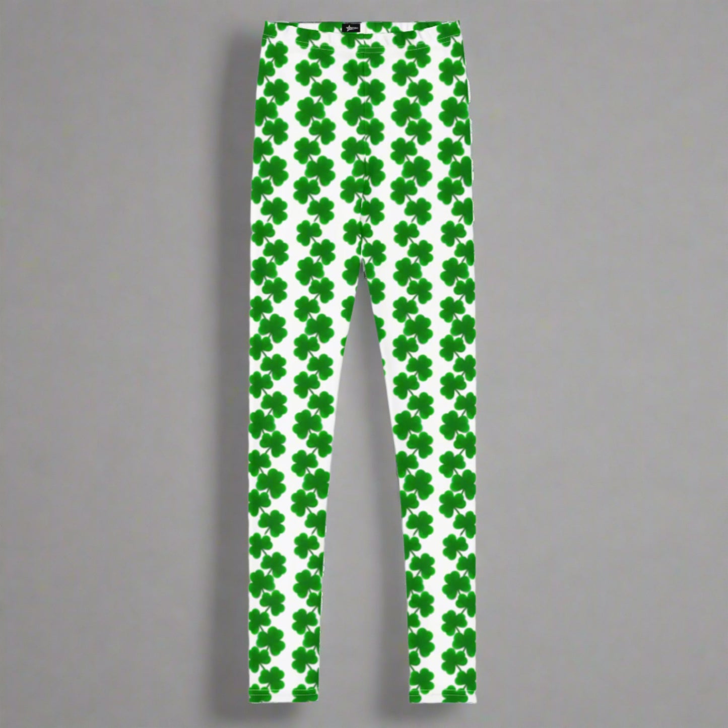 Image: St Patricks Day Shamrock Leggings in Tween and Teen Girls Sizes 8, 10, 12, 14, 16, 18, 20. These white yoga pants feature rows of four leaf clovers in a pattern down each leg, by jaecrece