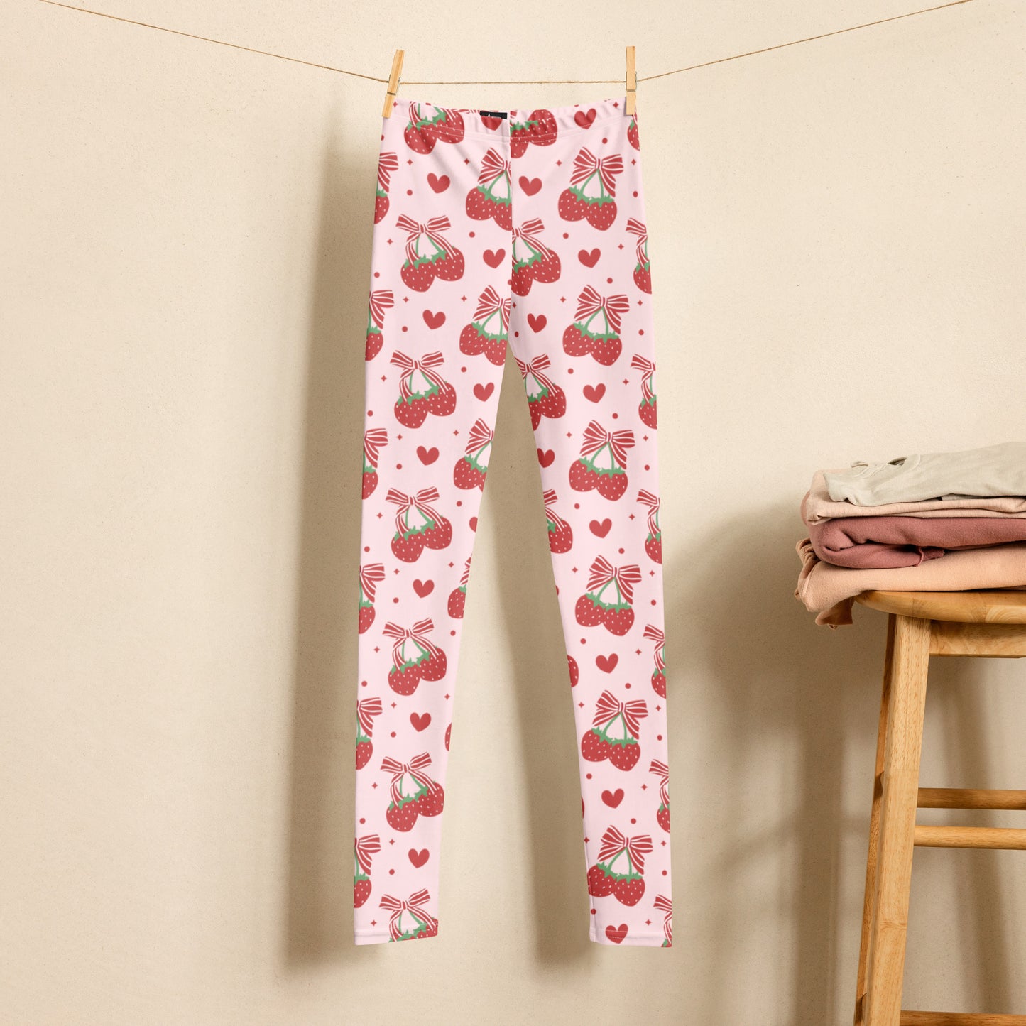 Image: With bright red bows and scattered strawberries across a pastel pink background, these leggings are perfect for girls and teens who love all things cute and comfy. Designed in sizes 8 to 20, they are ideal for fashion lovers who want a statement piece that’s great for class, cartwheels, or cozy nights in. Celebrate color, comfort, and fun with this fruity favorite, by jaecrece.