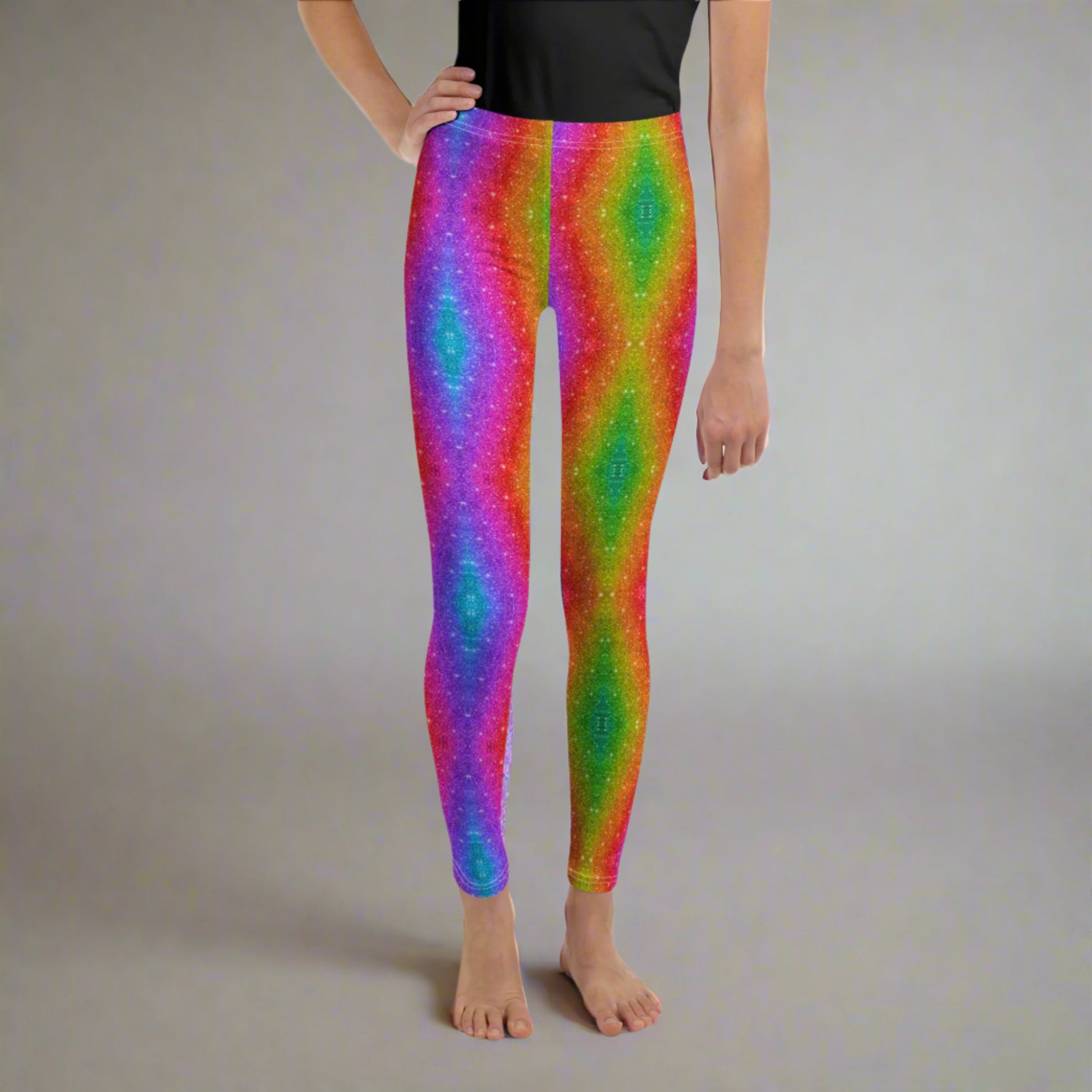 Colorful and comfy girls' leggings in sizes 8–20, featuring a vibrant rainbow swirl holographic glitter pattern. Ideal for tweens who love to stand out—perfect for school, parties, Pride Month, or fun family events. These high-quality leggings offer soft, stretchy fabric that moves with her, making them a must-have in her wardrobe for any occasion.
