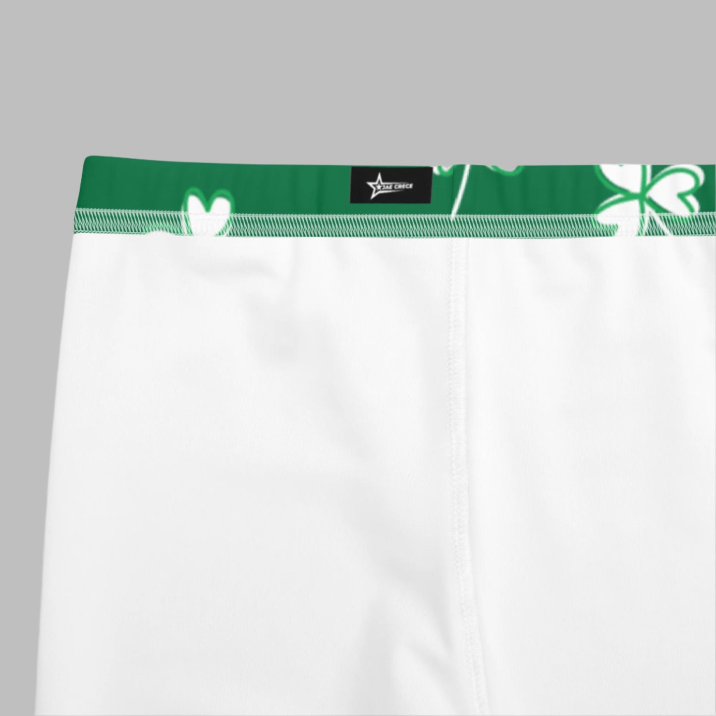 Image: Family Matching St Patricks Day Shamrock Leggings. Festive yoga pants with green background and white four leaf clovers. Available in sizes for toddler girls, teens, tweens, and women. Perfect for a St Pattys Day parade or fun run, by jaecrece