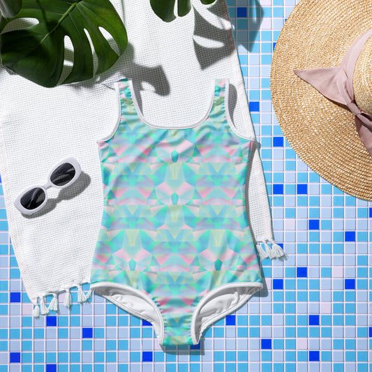 Image: one piece youth girls blue geometric bathing suit in sizes 8-20. This swimsuit has a geometric prism pattern in pastel shades of pink, purple and blue, by jaecrece