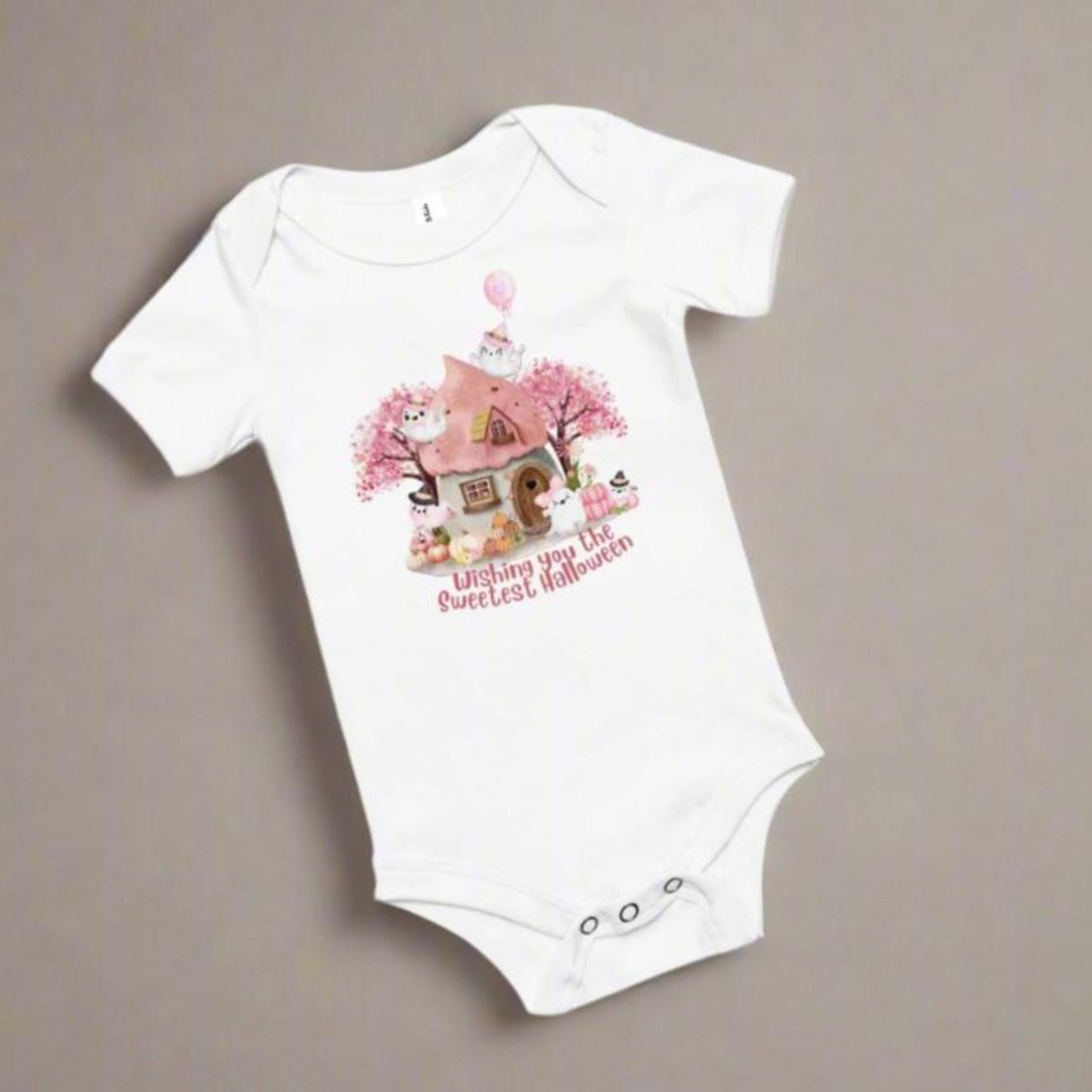 Image: This cozy Halloween baby bodysuit features a storybook-inspired design with pink pumpkins, cute ghost characters, and a soft autumn theme, great for baby's first fall holiday. Snap closures make diaper changes easy, while the pastel palette brings a touch of sweetness to spooky season, by jaecrece.