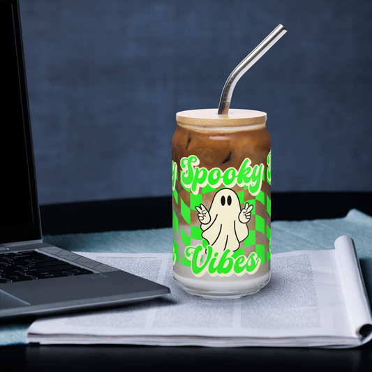 This 16 oz Spooky Vibes Halloween Sipper Glass features a bold neon green checkerboard pattern and a cute ghost giving peace signs, with “spooky vibes” text across the front. A must-have iced coffee cup for Halloween lovers, this eco-friendly bamboo lid glass tumbler is ideal for fall mocktails, spooky iced lattes, or party drinks. Perfect for Halloween drinkware collections and seasonal gifts.