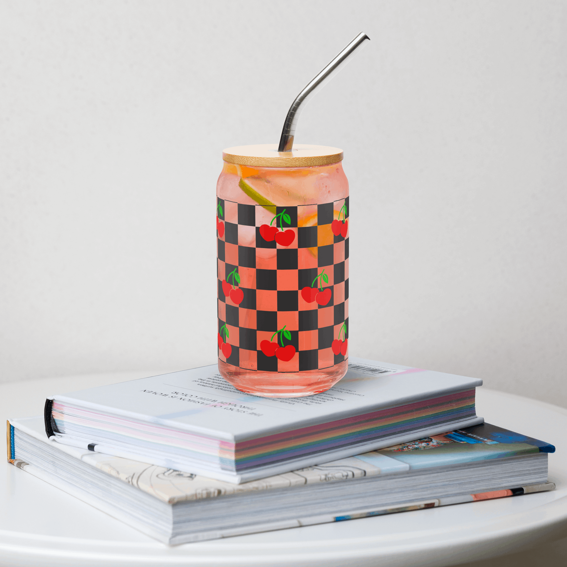 Cherry Checkerboard 16 oz Sipper Glass with wooden lid and metal straw, featuring a black checkboard pattern with red cherries and green stems. Perfect travel mug for iced coffee or mocktails, by jaecrece