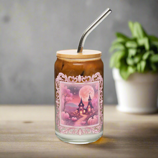 Sweet Pink Halloween 16 oz Sipper Glass, featuring a pink fairy tale castle, pink trees, pink pumpkins, pink moon and stars with a pink antique style frame- perfect as an iced coffee cup or mocktail glass, by jaecrece