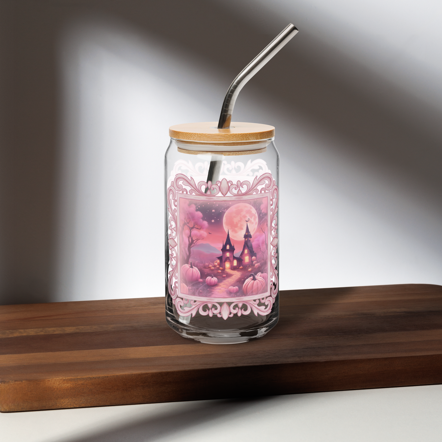 Sweet Pink Halloween 16 oz Sipper Glass, featuring a pink fairy tale castle, pink trees, pink pumpkins, pink moon and stars with a pink antique style frame- perfect as an iced coffee cup or mocktail glass, by jaecrece