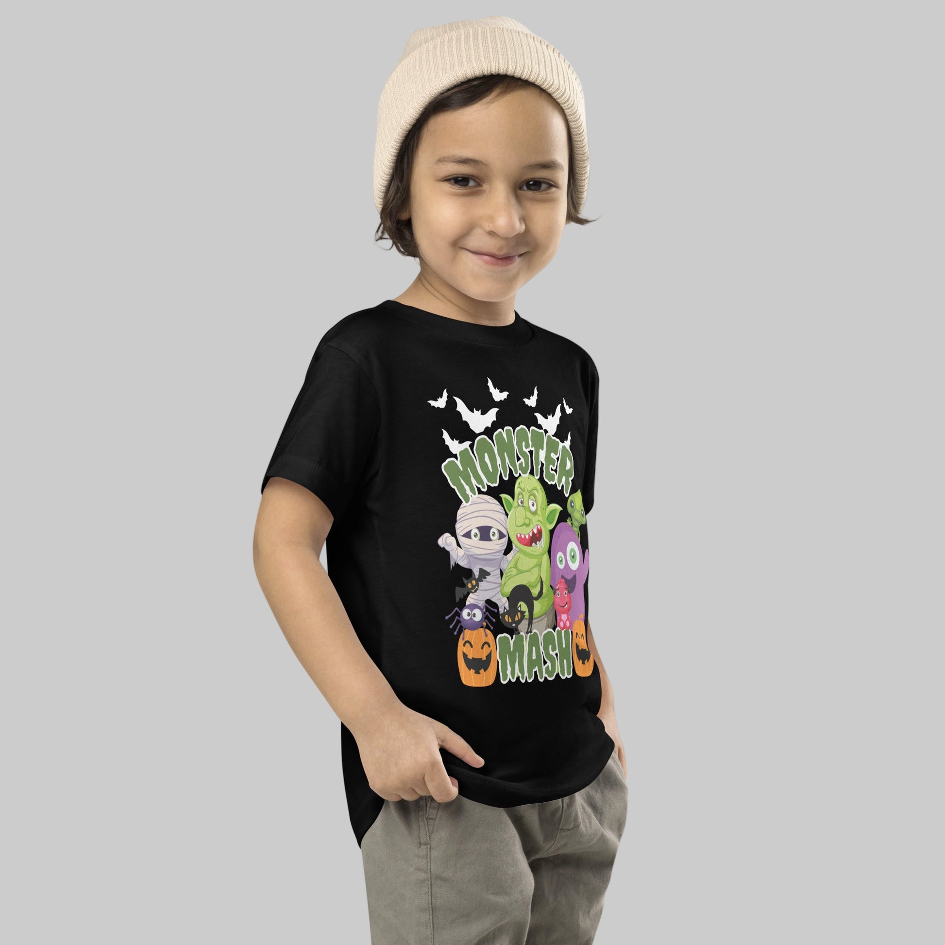 Toddler Monster Mash Halloween shirt in black featuring colorful cartoon monsters like a troll, mummy, pumpkin, bat, and spider. Designed for sizes 2T–5T, this toddler graphic tee is soft, durable, and perfect for fall festivals, costume parties, or everyday spooky vibes. A family matching toddler Halloween shirt option that pairs well with mom, dad, and sibling tees for group costumes, photos, or coordinated trick-or-treating looks.
