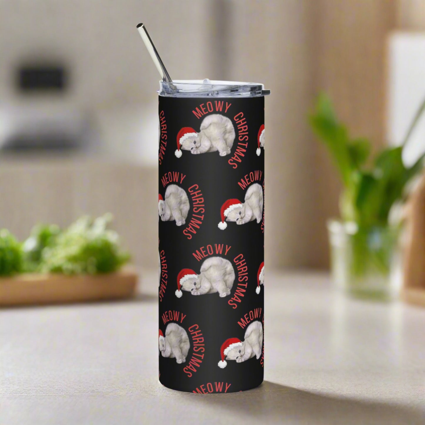 Meowy Christmas 20 oz Stainless Steel Tumbler, featuring a graphic of a grey kitten wearing a red Santa hat, with the text "Meowy Christmas", by jaecrece.com