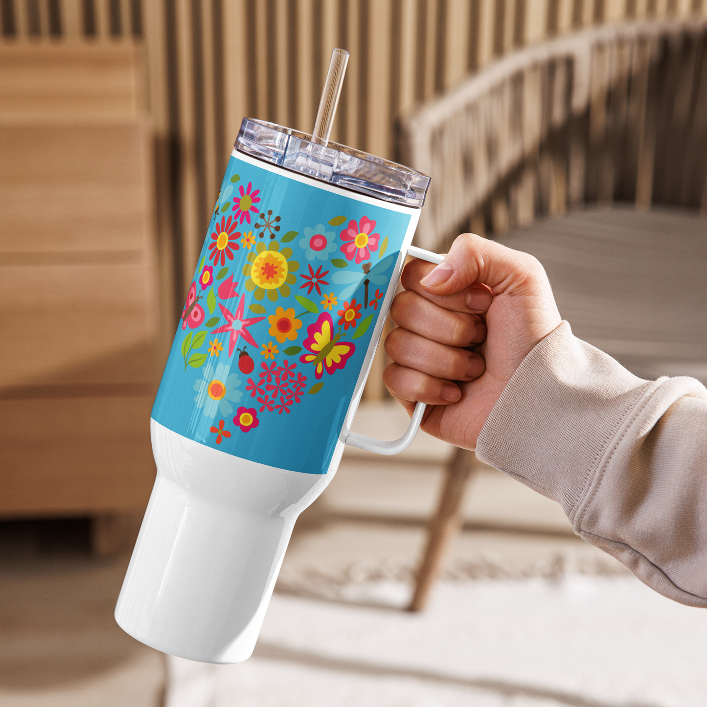 Image: A 40oz tumbler with an enchanting sunflower and butterfly design, blending boho and cottagecore aesthetics. This insulated stainless steel mug includes a handle, lid, and straw for easy sipping. Ideal for keeping drinks warm or cool, whether at the office, gym, or on the go. A delightful gift for sunflower lovers, tea drinkers, and anyone who adores nature’s beauty, by jaecrece.
