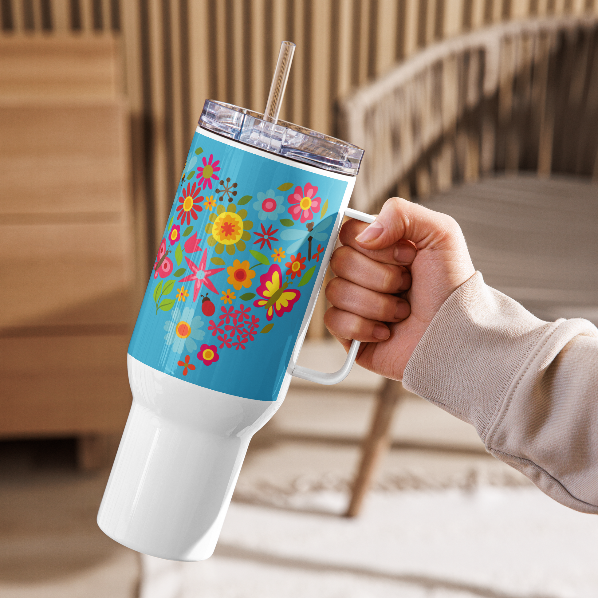 Image: A 40oz tumbler with an enchanting sunflower and butterfly design, blending boho and cottagecore aesthetics. This insulated stainless steel mug includes a handle, lid, and straw for easy sipping. Ideal for keeping drinks warm or cool, whether at the office, gym, or on the go. A delightful gift for sunflower lovers, tea drinkers, and anyone who adores nature’s beauty, by jaecrece.
